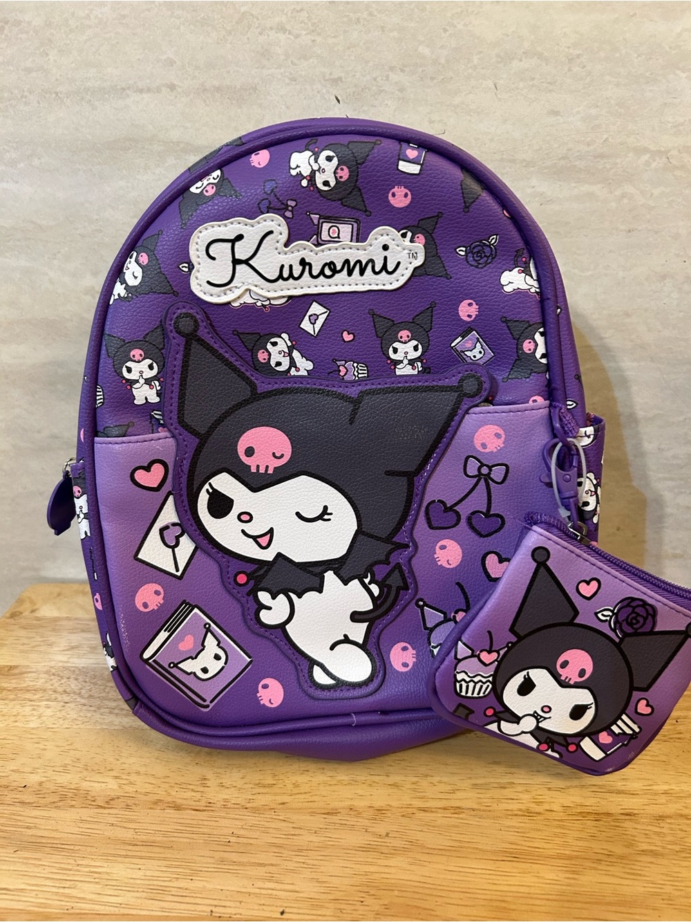 Sanrio Licensed Kuromi 
Backpack with a matching detachable coin purse.